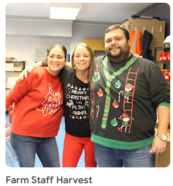 teacher and students in christmas sweaters