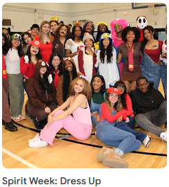 students in costume posing for group photo