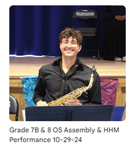 musician in the orchestra holding saxophone