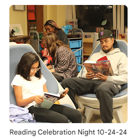 Student and parent reading a book in a classroom