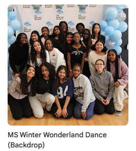 middle schoolers posing for a photo in front of backdrop