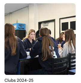 students talking to each other during club meeting