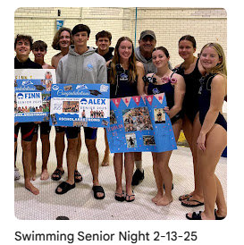 swim team holding posters