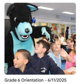 Sammy the Seawolf high-fiving new 6th graders