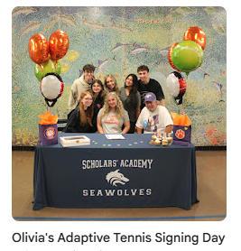 Olivia with friends and family during her signing
