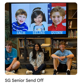 Senior student government leaders sitting with baby photo