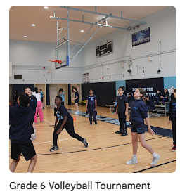 6th grade students playing volleyball in the gym