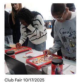 students doing an activity at the medical club table