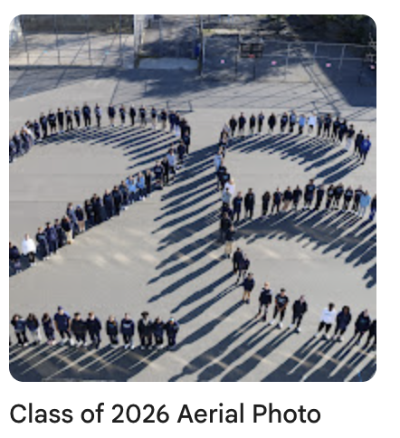 Senior class of 2026 taking grade photo in the yard