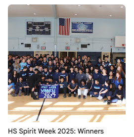 Winners of spirit week taking class photo in gymasium