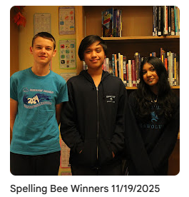 Spelling bee winners taking photo in library
