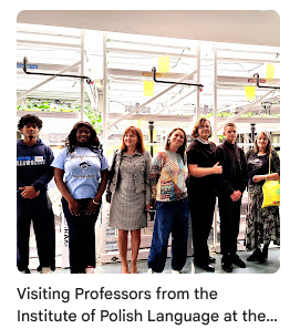 visiting guests taking photo with student government in farm room