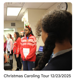 Carolers in classroom singing