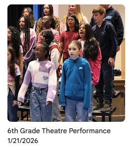 6th grade chorus members singing on stage
