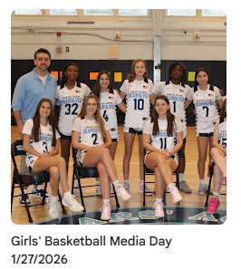 Girls basketball players taking group photo