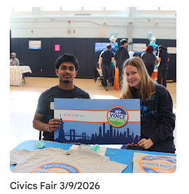 Student government members holding up sign during civics fair