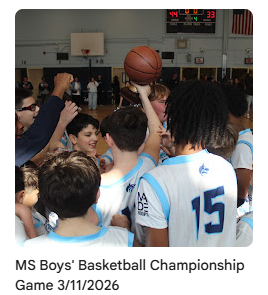 Middle school team in a huddle cheering together