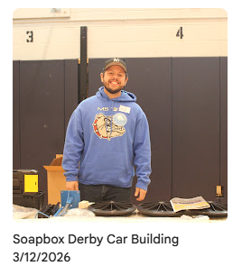 Attendee standing behind his soapbox in construction