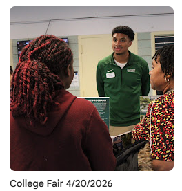 Representative from Binghamton talking to a student