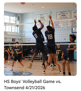 Volleyball players jump to block the ball