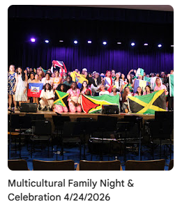 Performers taking group photo on stage